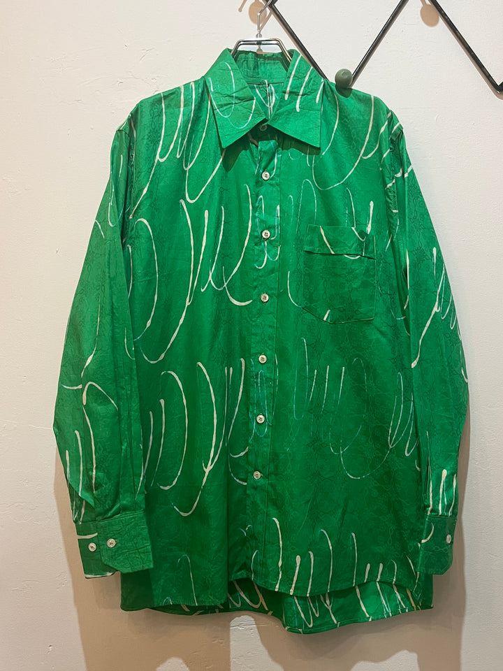 green drawing pattern shirt