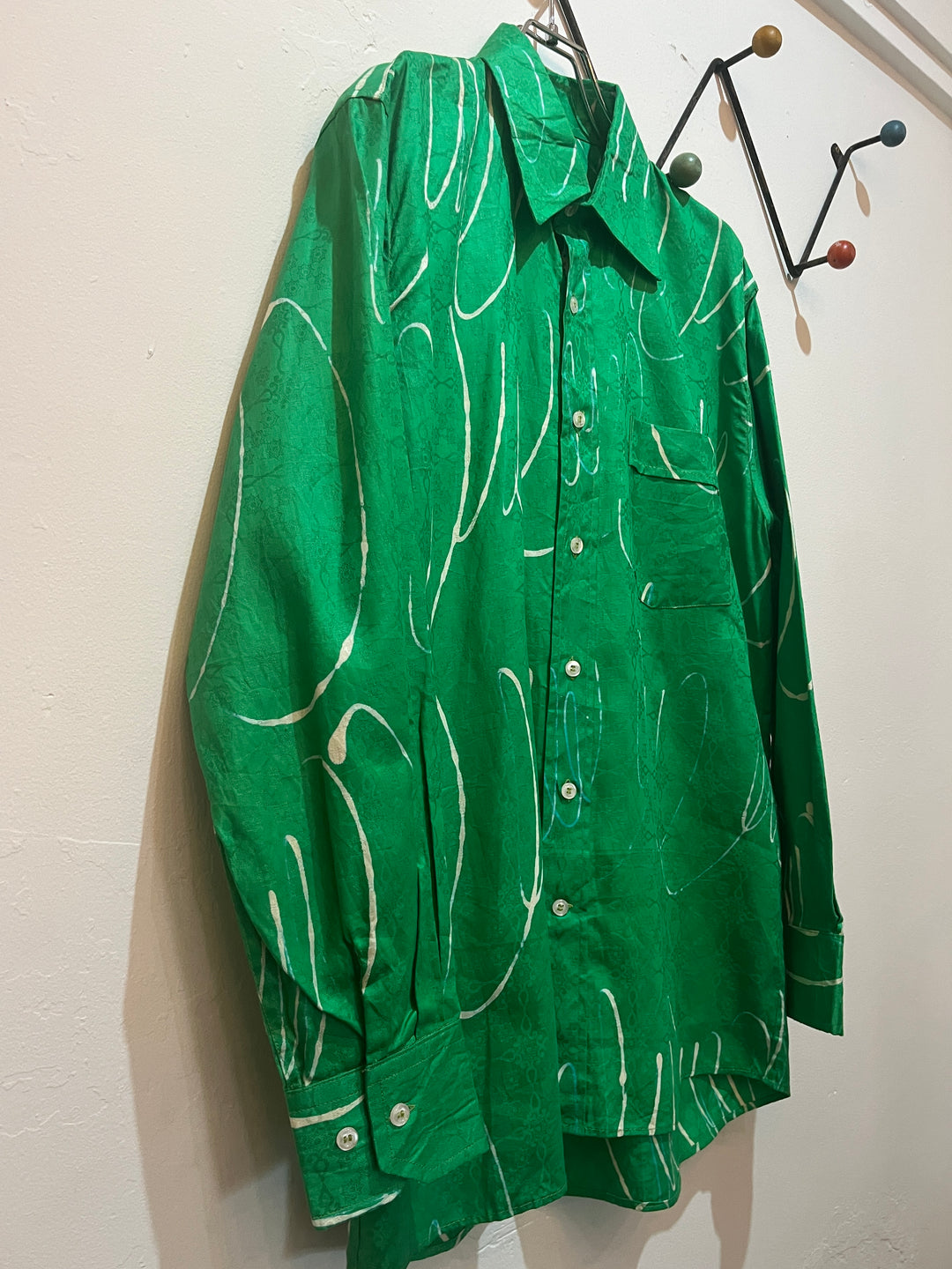 green drawing pattern shirt