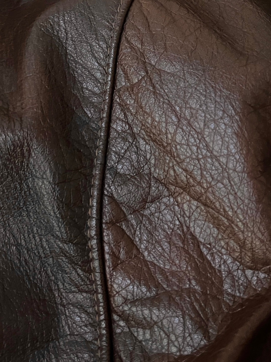 dark brown cowhide leather coat