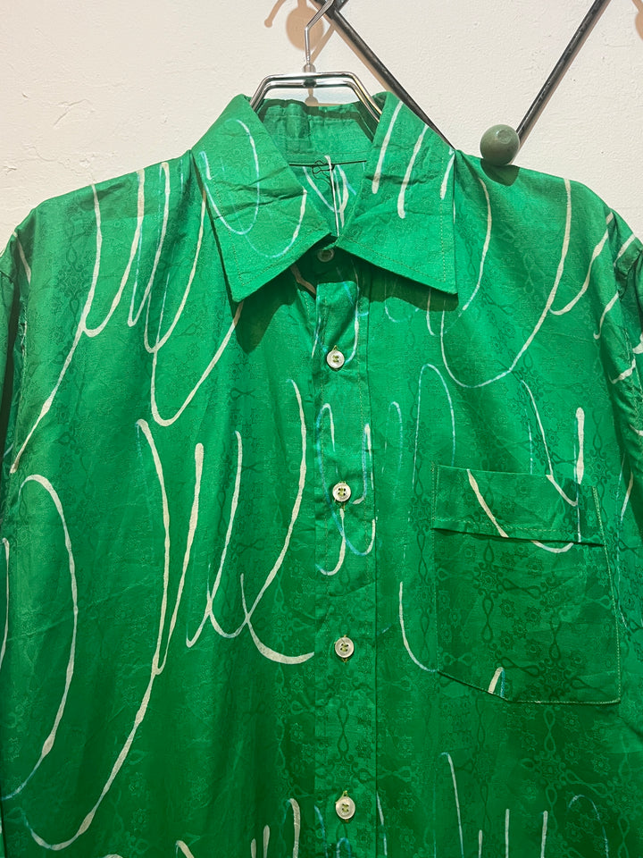 green drawing pattern shirt